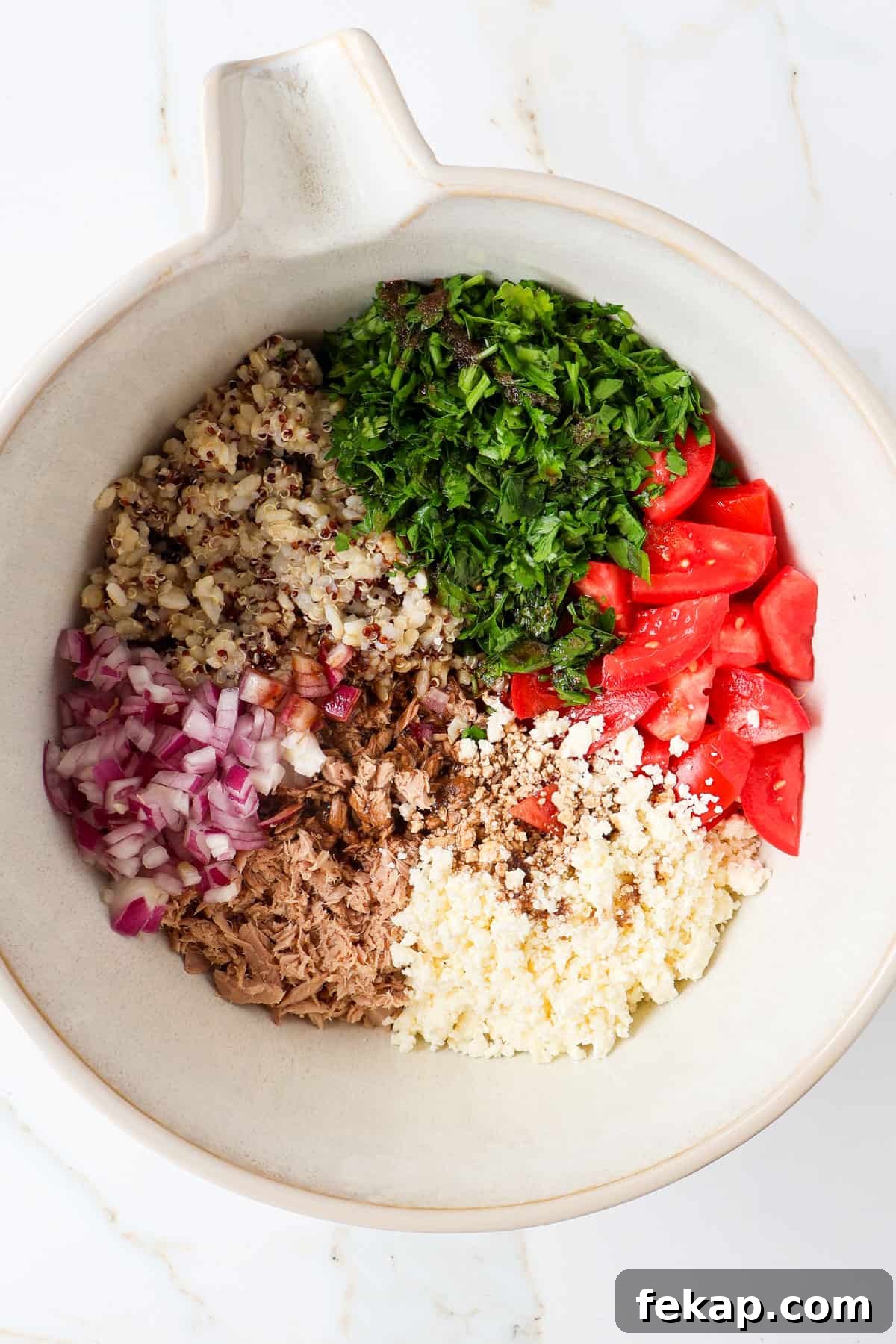 Mediterranean Tuna and Tomato Salad Recipe 5 Ingredients in a mixing bowl.
