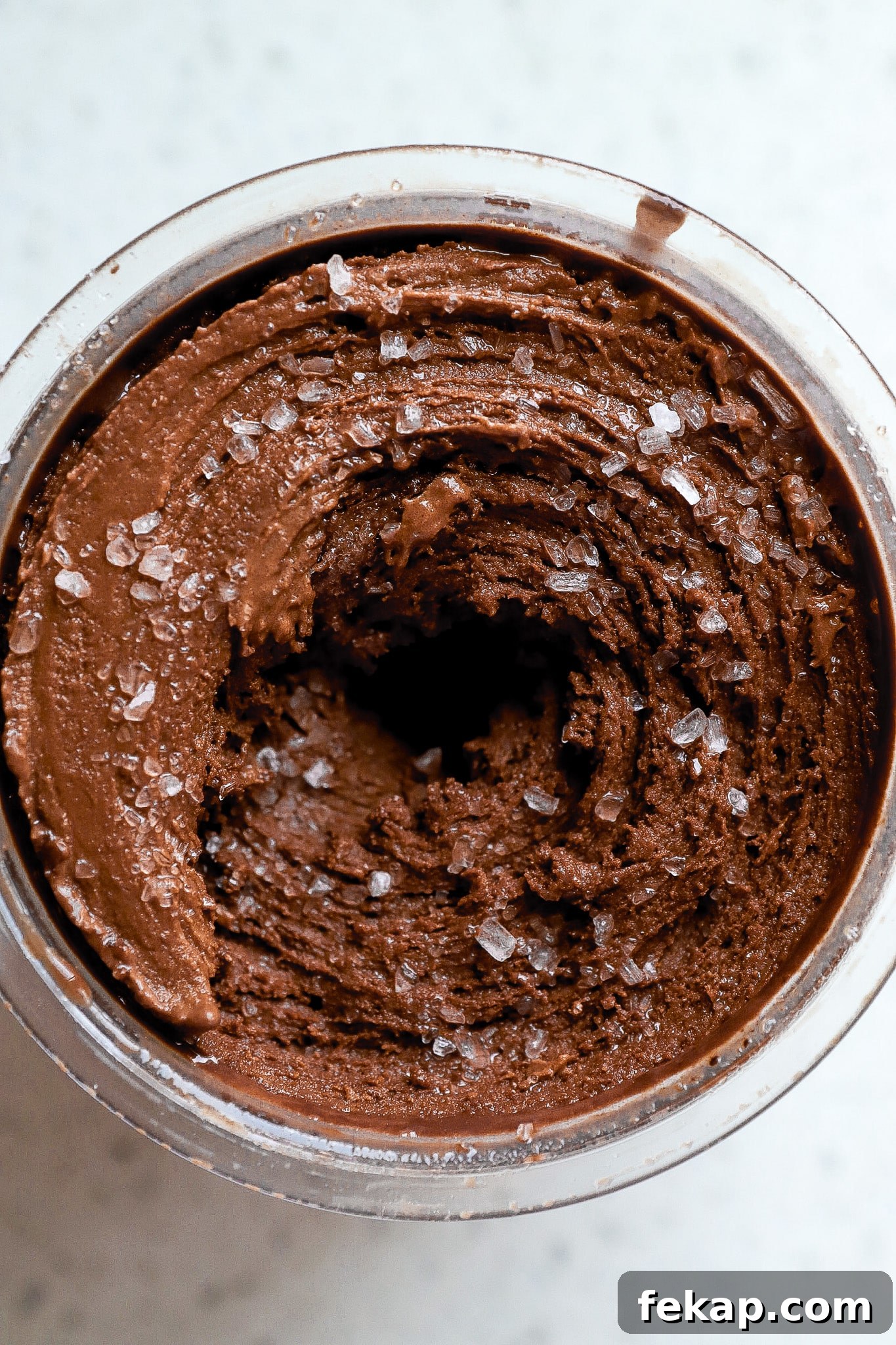 Ninja Creami Salted Chocolate Protein Ice Cream Recipe 5 Top down view of chocolate protein ice cream in ninja creami pint container.