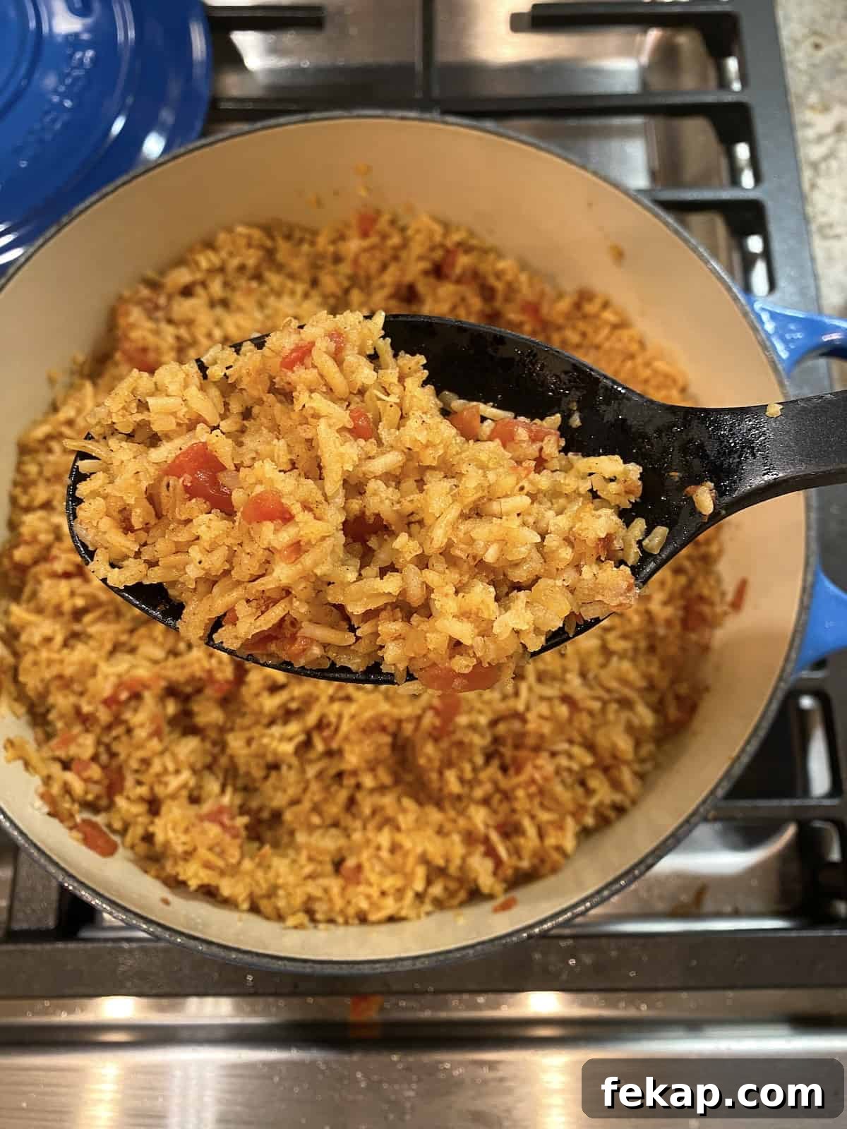 Restaurant-Style Mexican Fried Rice Recipe 2 A large pot full of cooked Mexican rice.