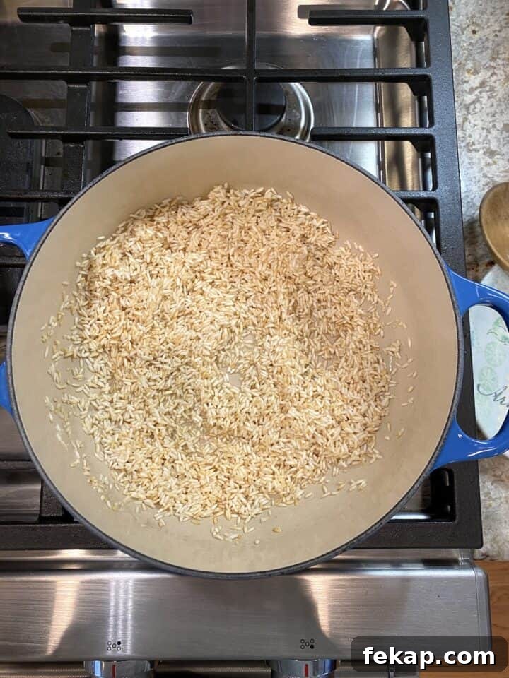 Restaurant-Style Mexican Fried Rice Recipe 11 A pot of rice, halfway through the cooking and browning process.