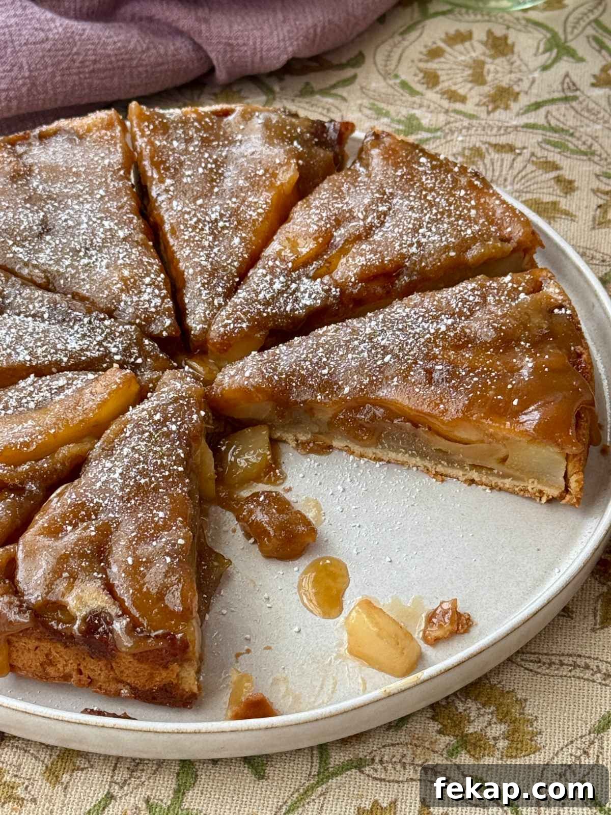 Pear Upside-Down Cake with Warm Fudge Sauce 2 pear upside down cake on a plate.