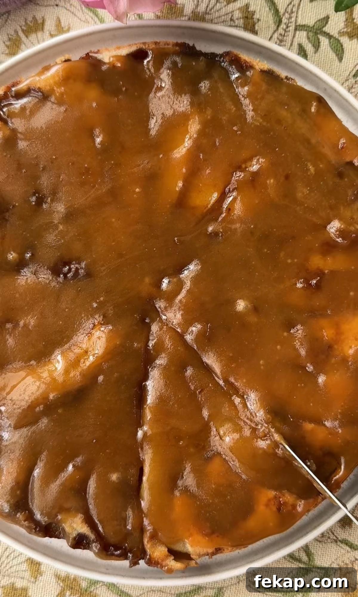 Pear Upside-Down Cake with Warm Fudge Sauce 9 pouring fudge sauce on pear cake.