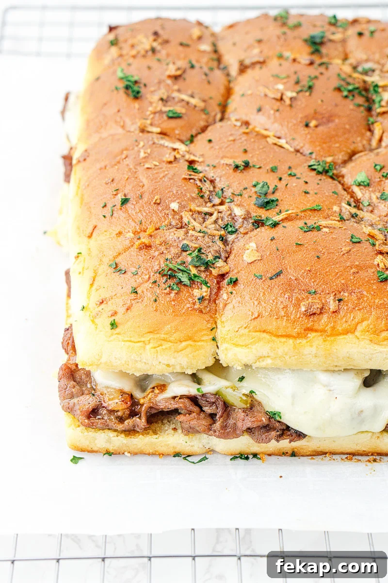 Philly Cheesesteak Sliders on Hawaiian Rolls Game Day Recipe 8 Finished dish of Philly cheesesteak Hawaiian roll slider.