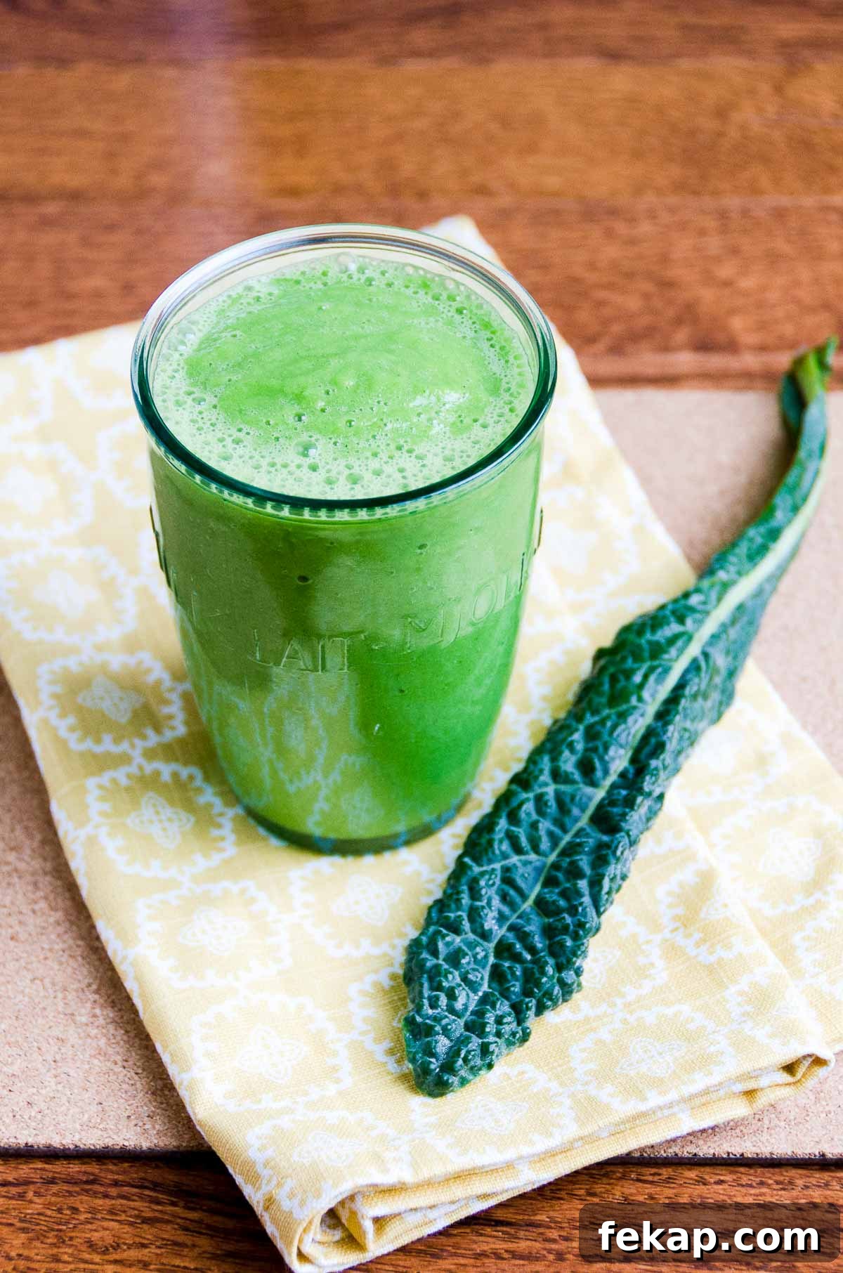 Green Smoothie Recipe for Radiant Skin 2 a glowing green smoothie and a piece of kale