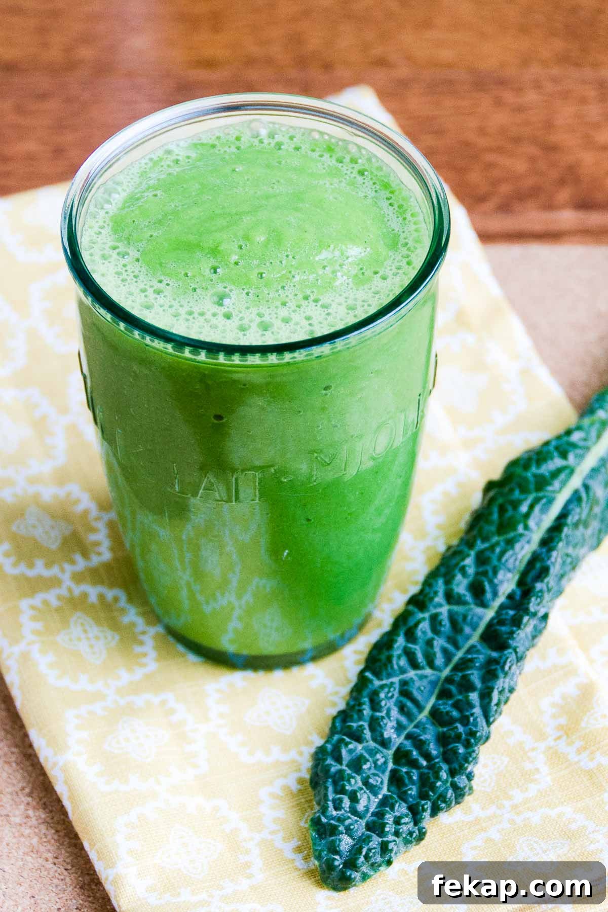 Green Smoothie Recipe for Radiant Skin 5 a glowing green smoothie and a piece of kale