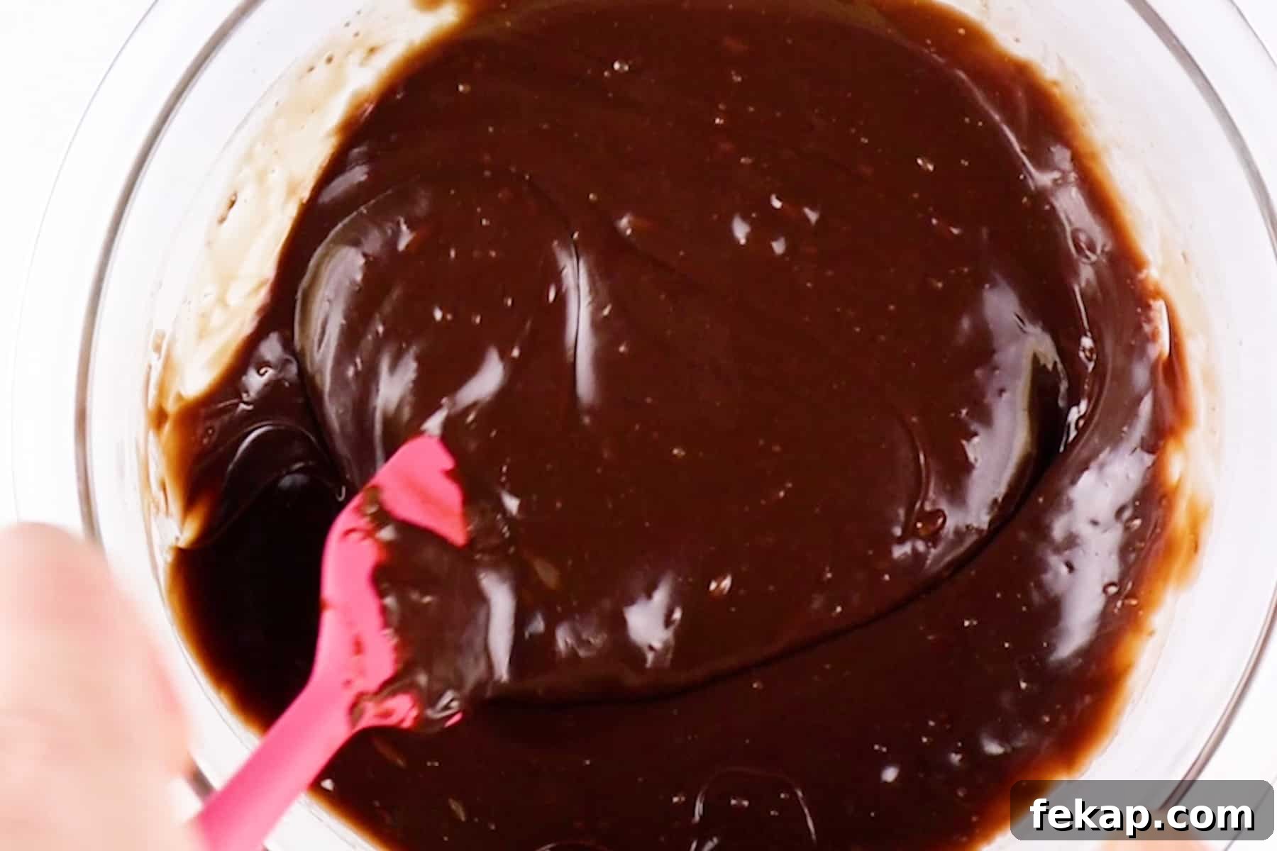 Moist Chocolate Strawberry Cake Recipe 12 smooth ganache in glass bowl.