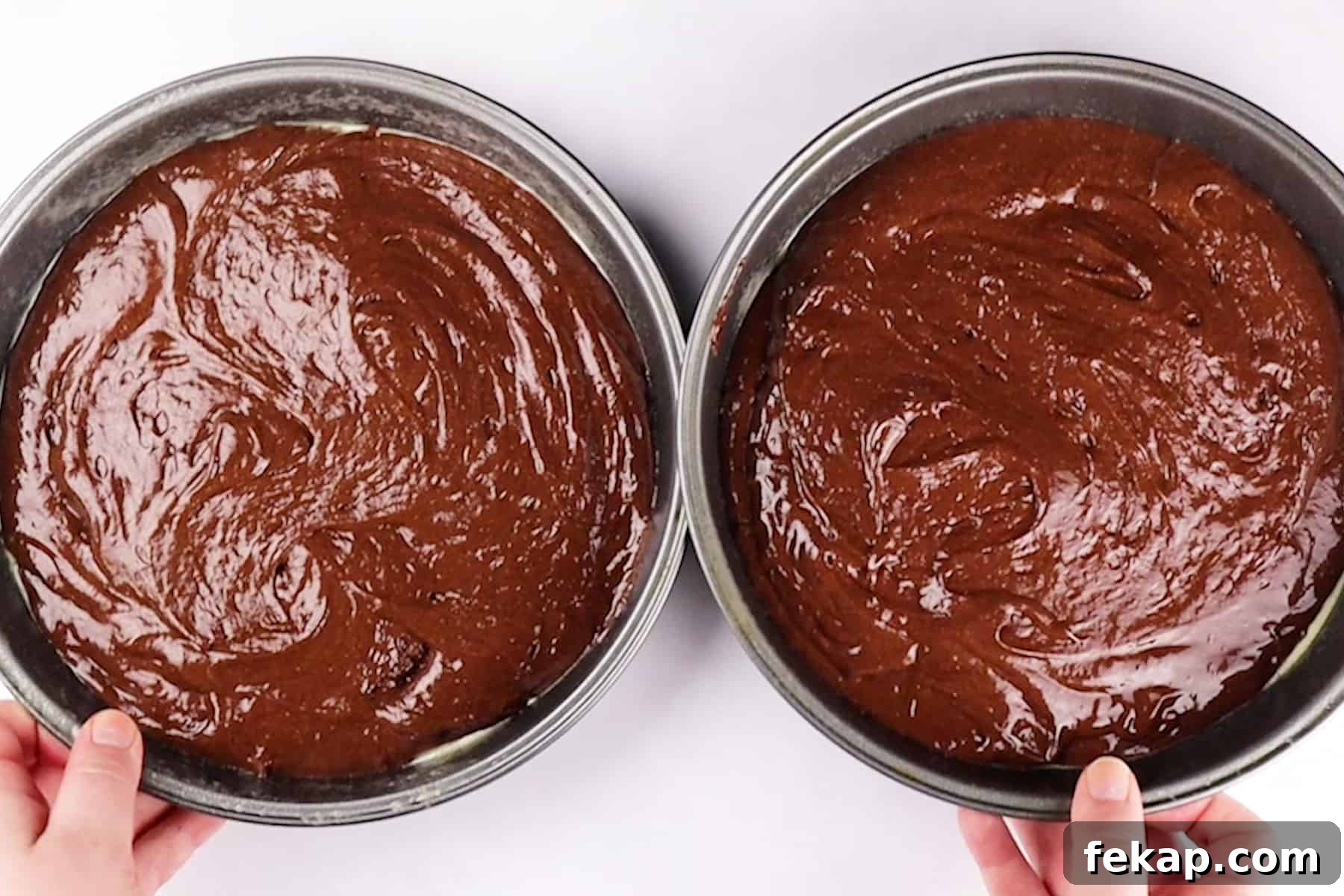 Moist Chocolate Strawberry Cake Recipe 7 chocolate cake batter in cake pans.