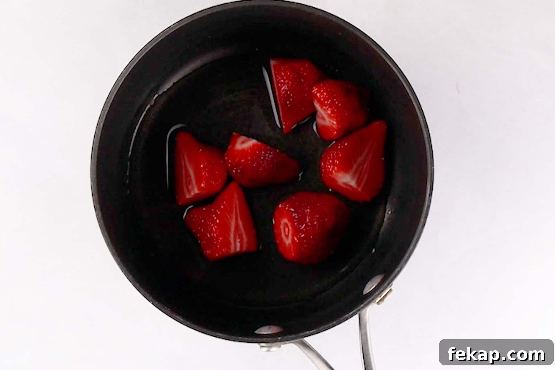 Moist Chocolate Strawberry Cake Recipe 9 strawberries in sauce pan.