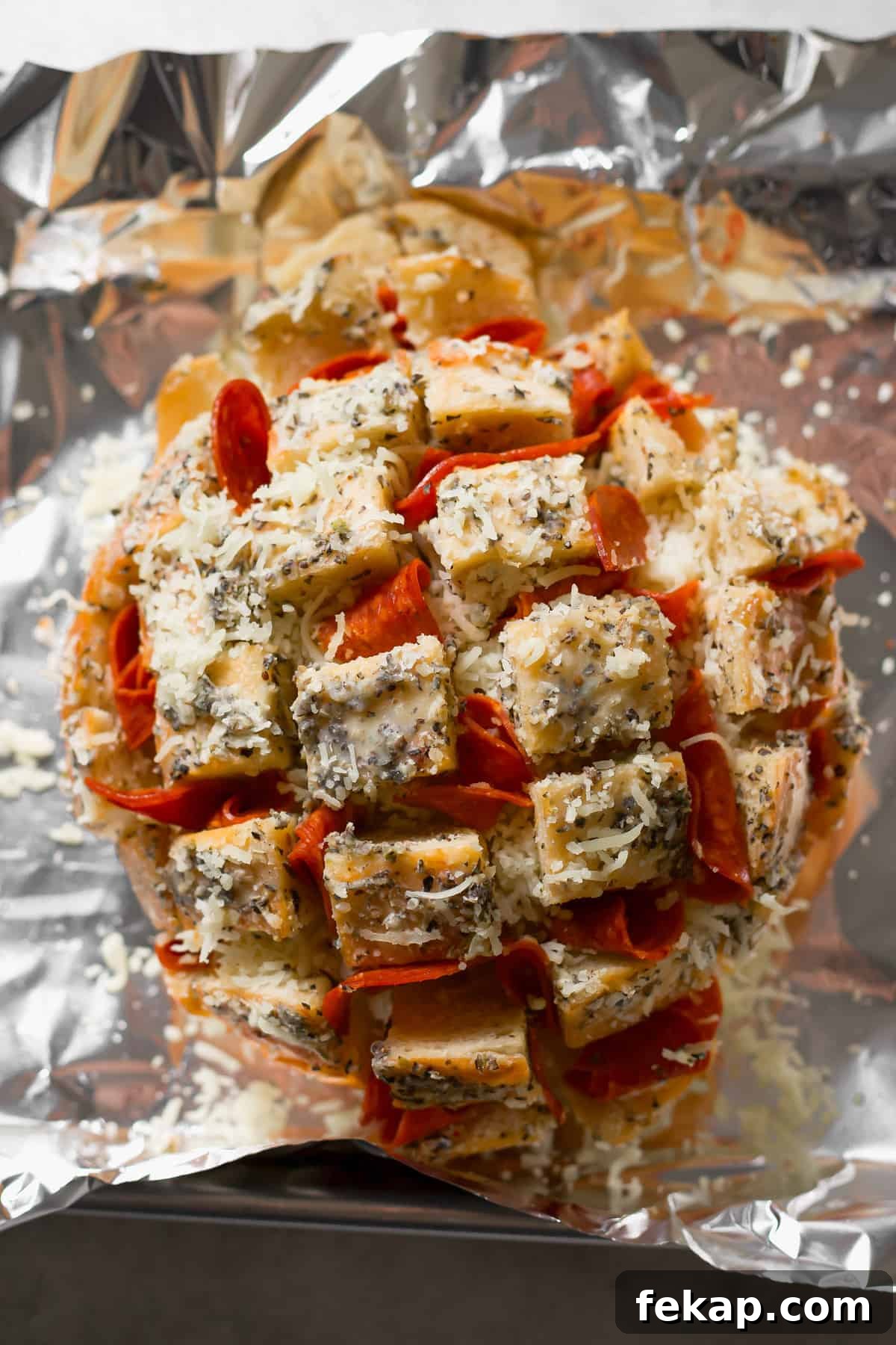 stuffing bread with pepperoni and shredded cheese