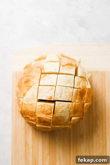 a loaf of bread on a cutting board.