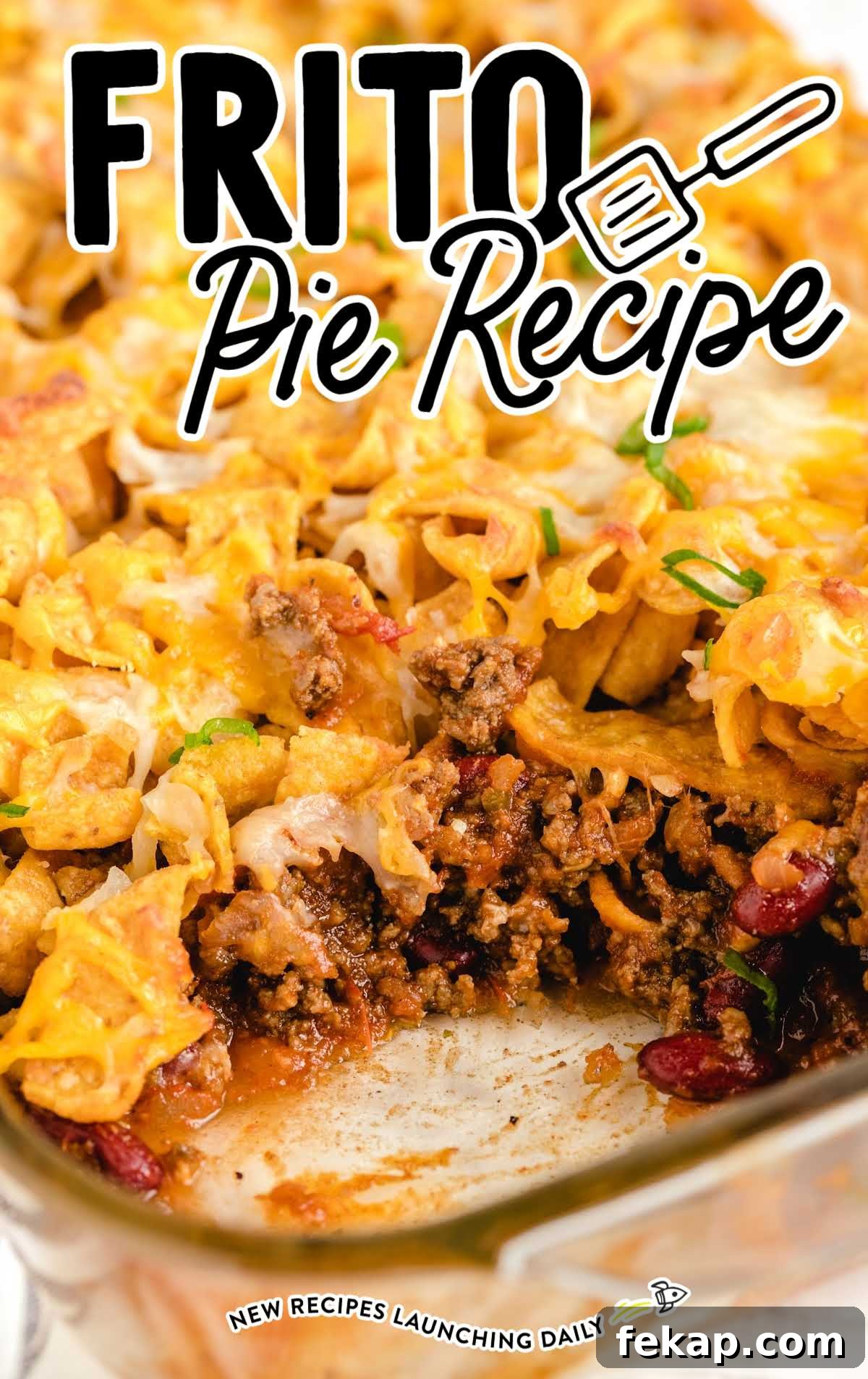 Frito Pie Casserole Recipe: Baked Chili and Cheese 2 close up shot of Frito Pie in a baking dish with a slice taken out