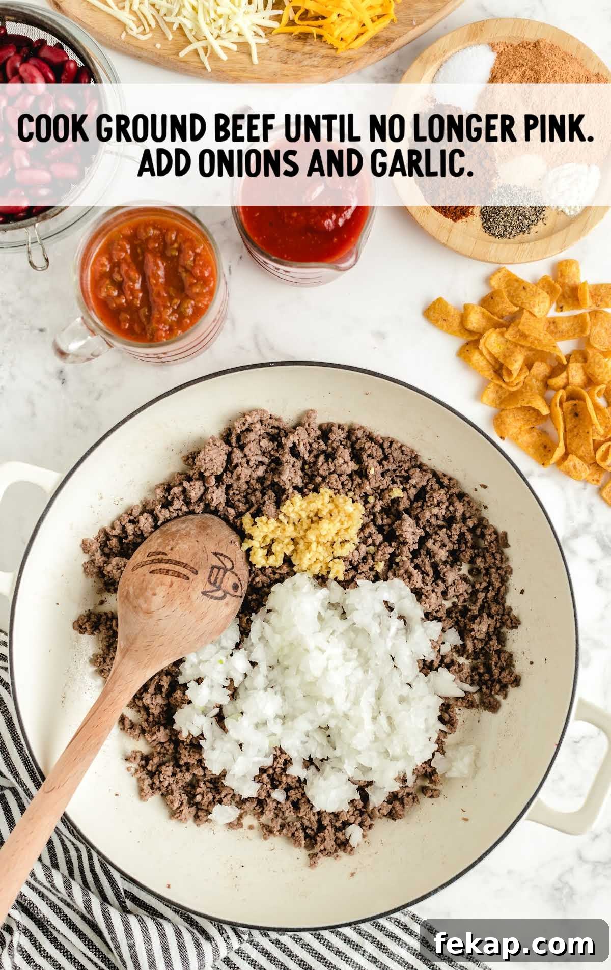 Frito Pie Casserole Recipe: Baked Chili and Cheese 4 cooked ground beef and then add garlic and onion in a bowl