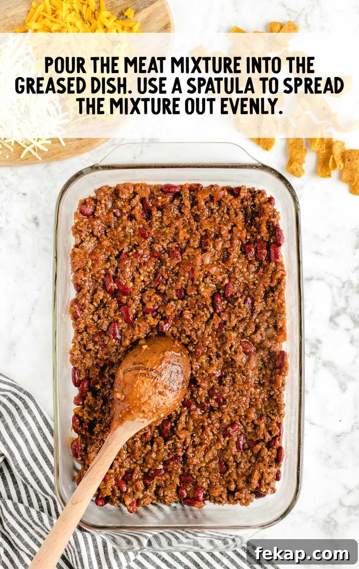Frito Pie Casserole Recipe: Baked Chili and Cheese 6 meat mixture spread evenly into the baking dish