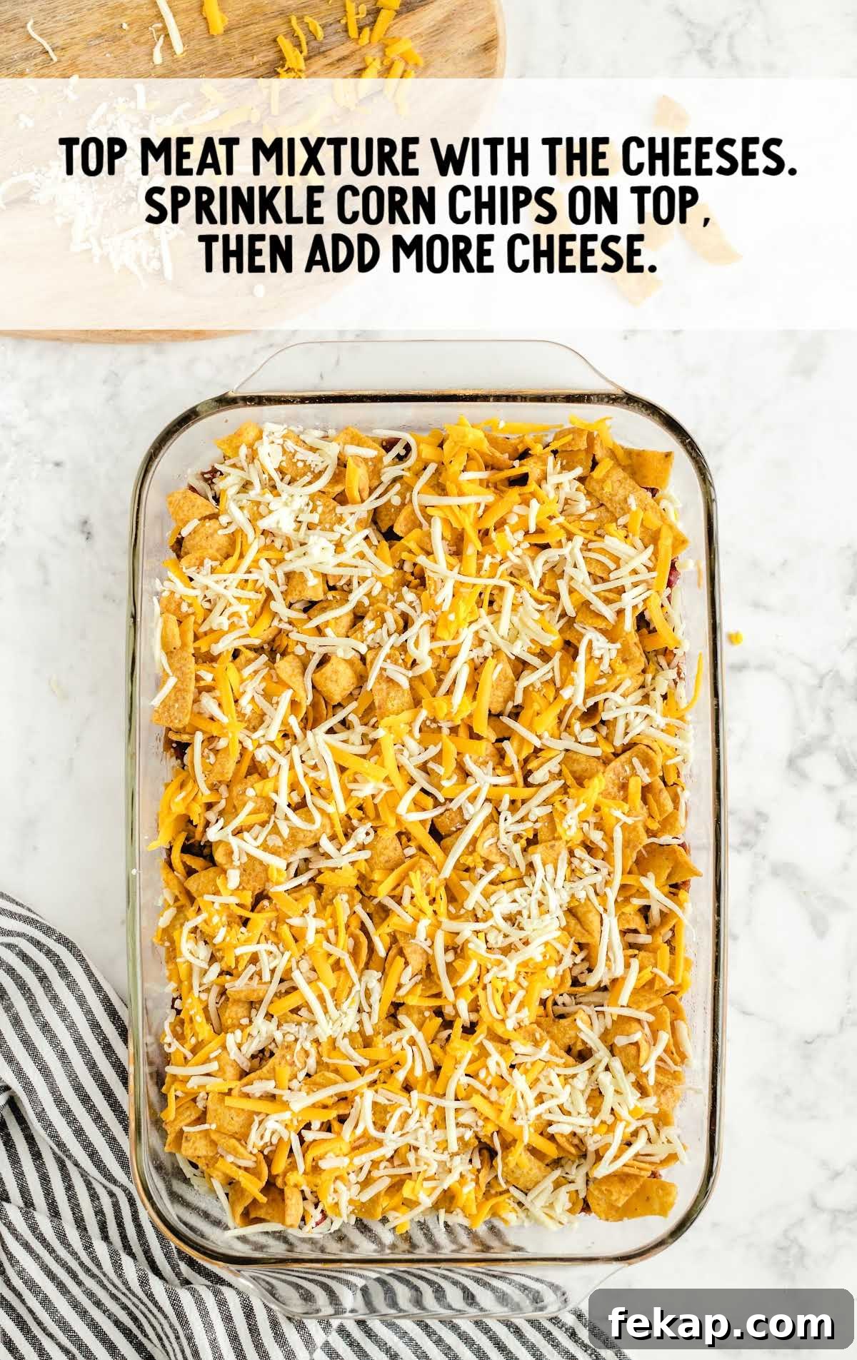 Frito Pie Casserole Recipe: Baked Chili and Cheese 7 cheese and corn chips sprinkled on top of the mixture in a baking dish