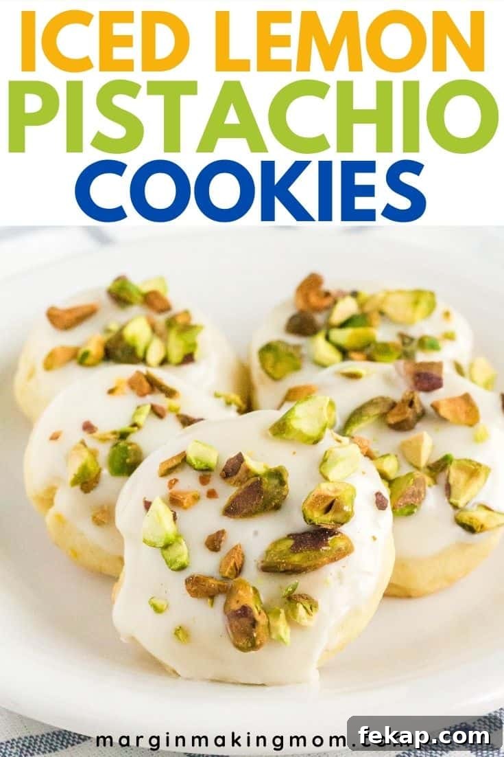 Five lemon pistachio cookies arranged on a white plate