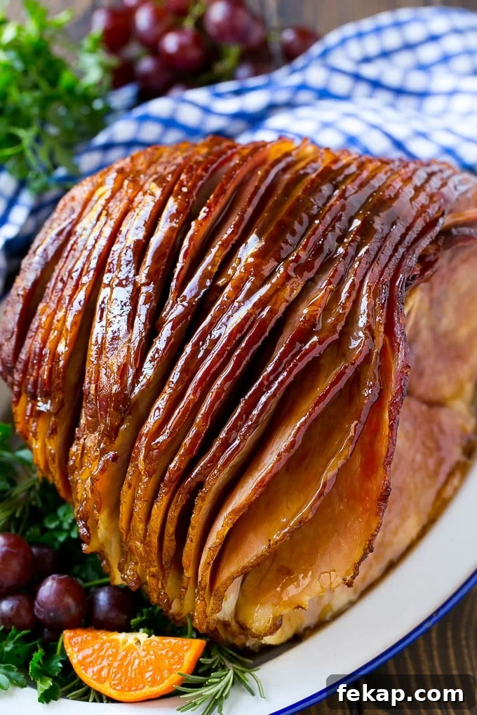 Coca Cola Ham | Coke Glazed Ham | Holiday Ham A whole spiral cut coca cola ham on a platter.