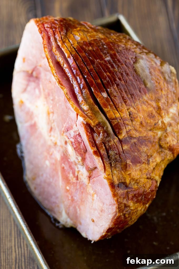 Uncooked spiral ham with glaze An uncooked spiral ham topped with coke and brown sugar.