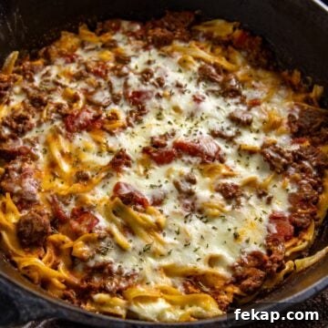 Baked casserole in a cast iron skillet.
