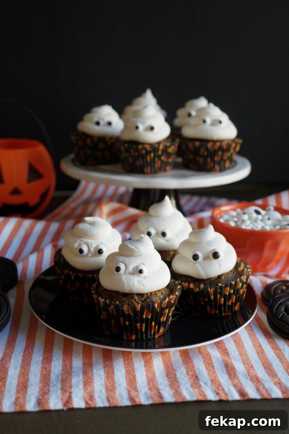 Vegan Oreo Pumpkin Cupcakes with Creamy Frosting 4 oreo pumpkin cupcakes on plate