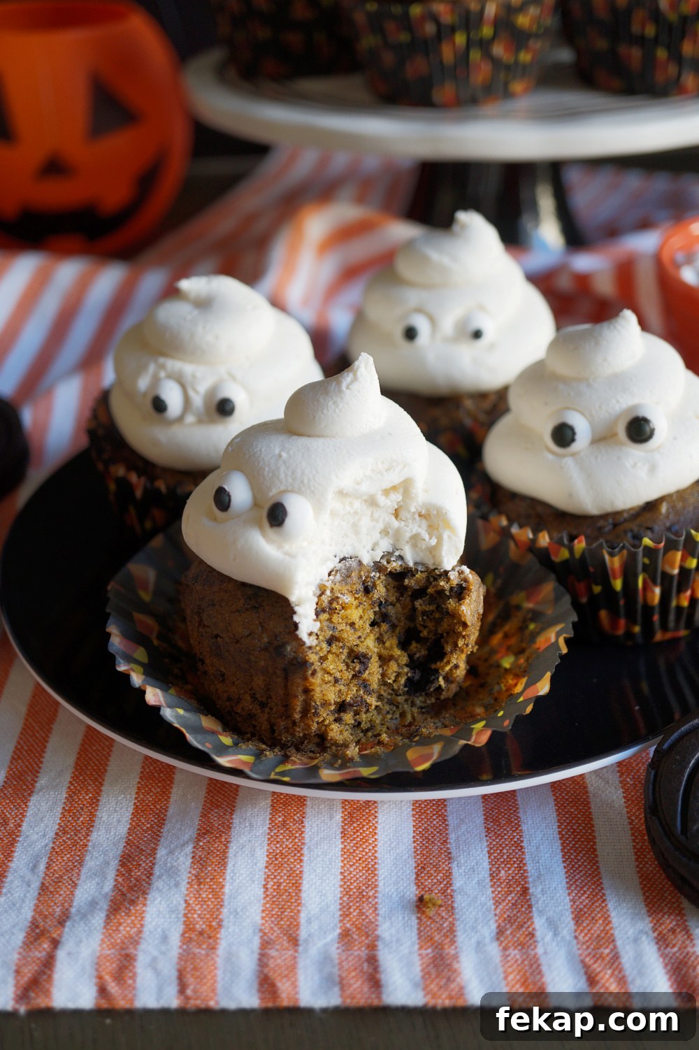 Vegan Oreo Pumpkin Cupcakes with Creamy Frosting 7 oreo pumpkin cupcake with bite taken out