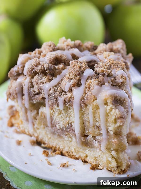 Pumpkin Cheesecake Crumb Cake with Cinnamon Streusel 4 Piece of Cinnamon Apple Crumb Cake in front of bunch of apple.