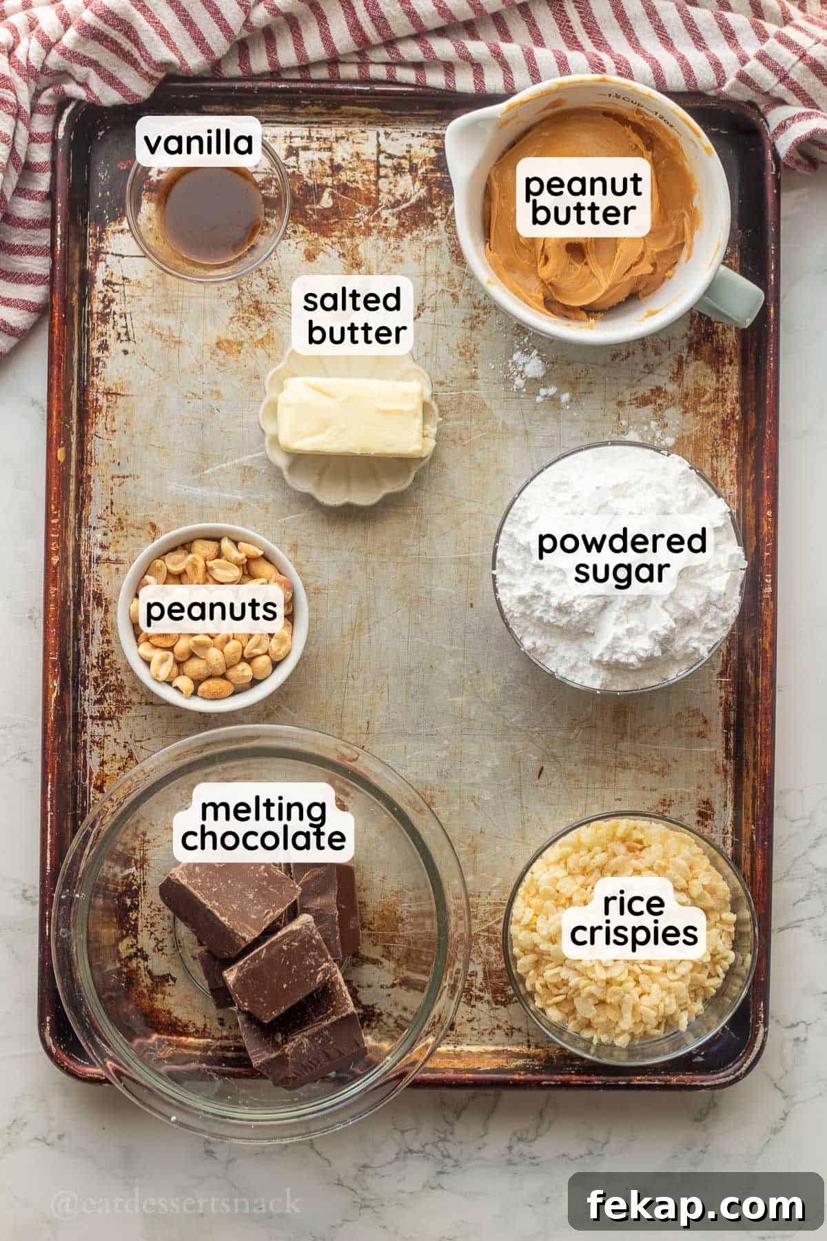 Labeled ingredients for peanut butter balls on metal tray.