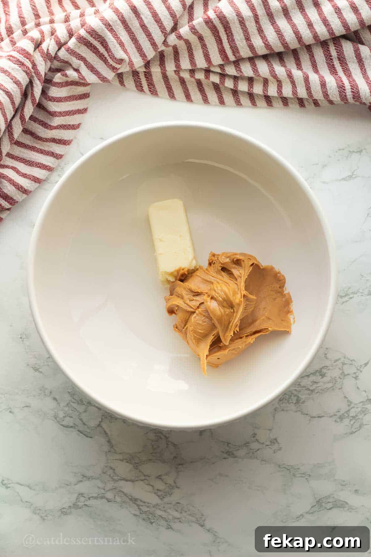 Butter and peanut butter in bowl.