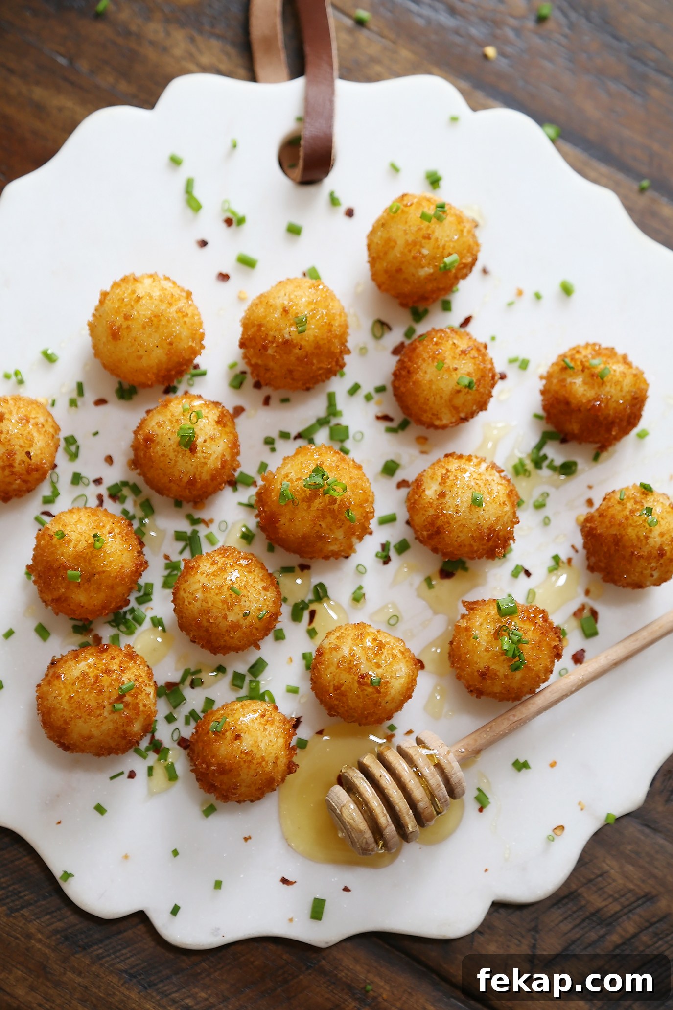 Crispy Goat Cheese Poppers with Honey Drizzle 4 Golden fried goat cheese bites with honey drizzle