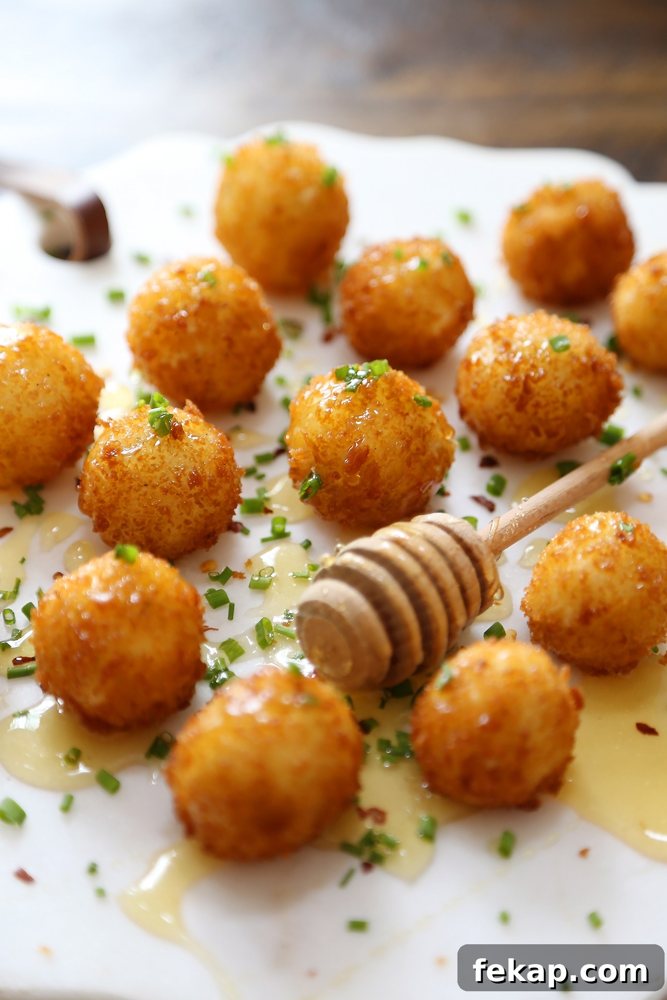 Crispy Goat Cheese Poppers with Honey Drizzle 7 Creamy goat cheese poppers with a crisp panko coating