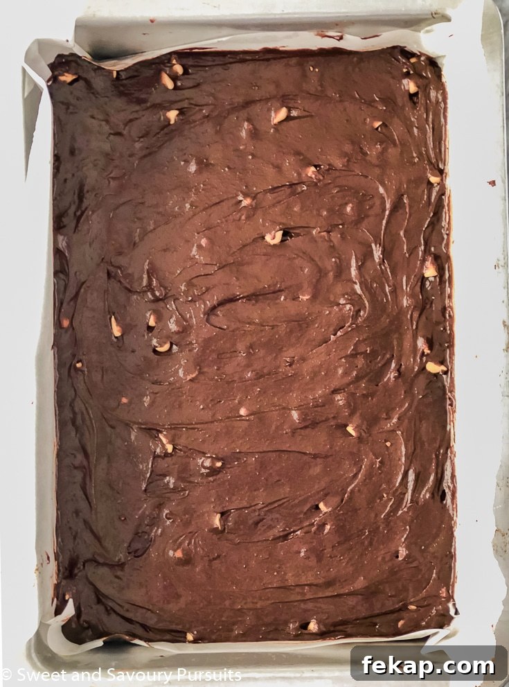 Fudgy Salted Caramel Chocolate Chip Brownies Recipe 3 Unbaked tray of salted caramel chip brownies.