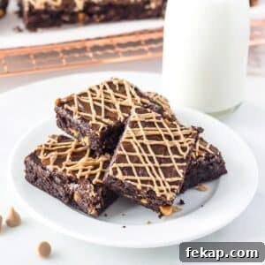 Fudgy Salted Caramel Chocolate Chip Brownies Recipe 5 Salted caramel chip brownies on small plate.