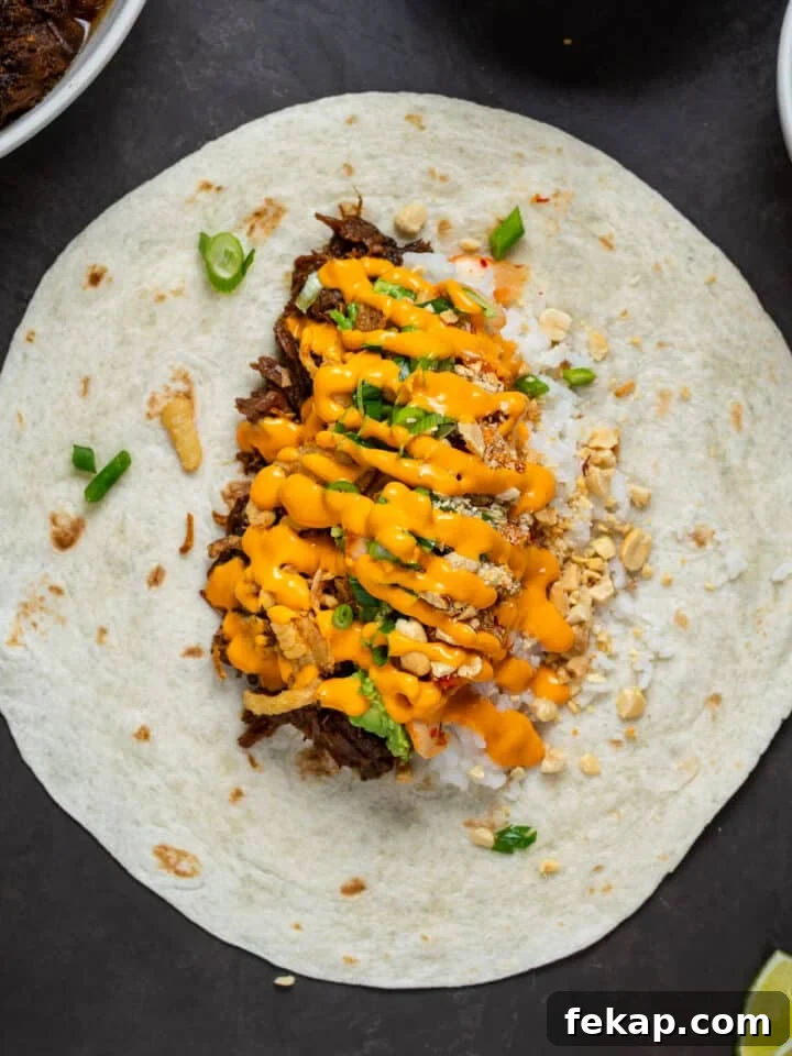 Korean BBQ Shredded Beef Burritos Recipe 9 sriracha mayo drizzled over burrito fillings