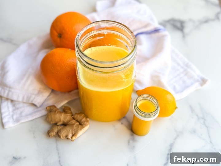 DIY Ginger Immunity Shots for Cold and Flu Defense 5 Small glass with an immunity shot