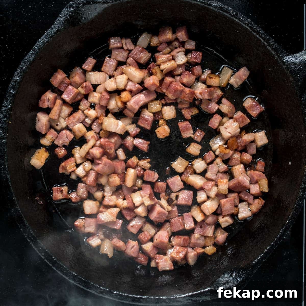 Classic Haluski: Fried Cabbage and Noodles with Bacon 4 Cooking the bacon for haluski in a skillet.