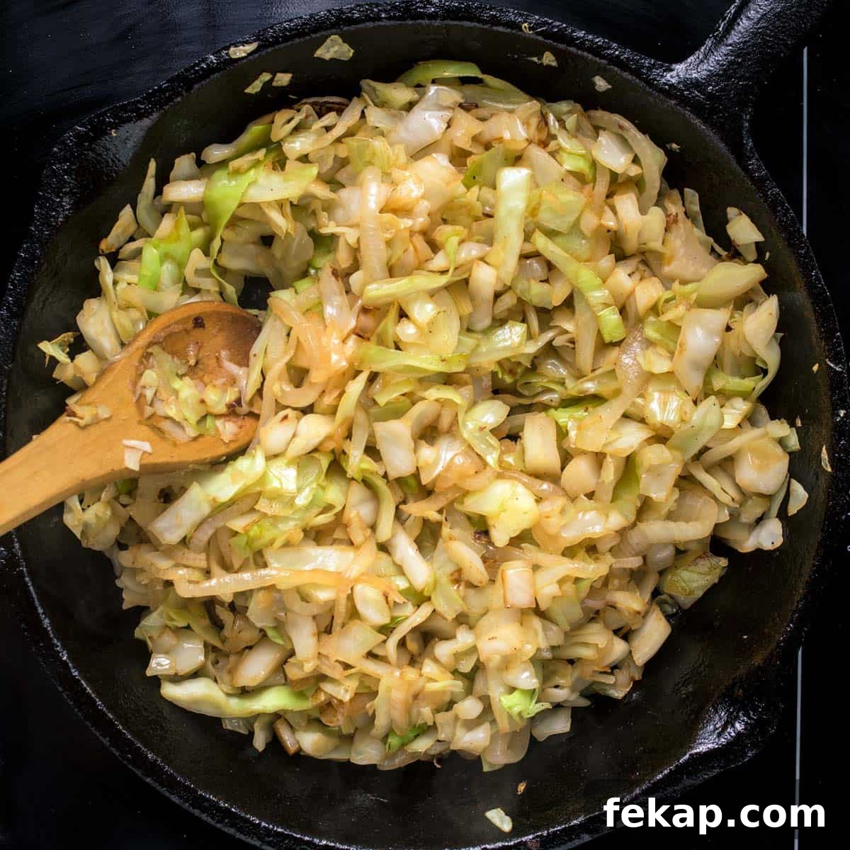 Classic Haluski: Fried Cabbage and Noodles with Bacon 6 Frying the cabbage for haluski in a cast-iron skillet.