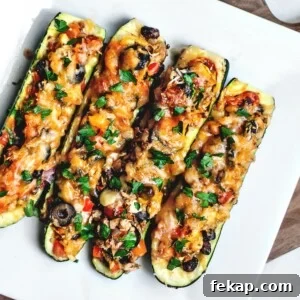 Tex Mex stuffed zucchini boats on a platter.