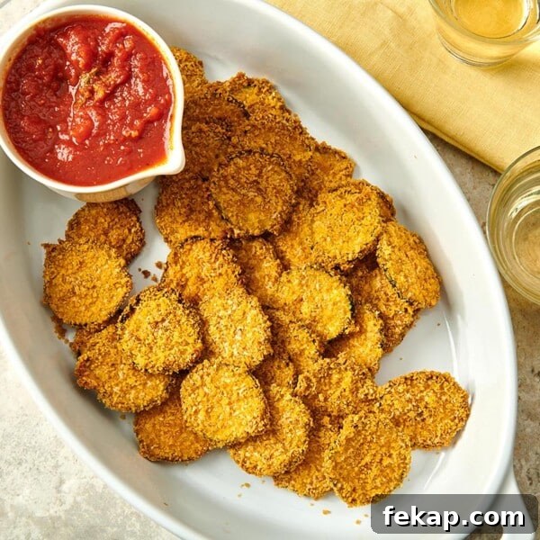 7 Delicious Ways to Cook Zucchini: Roast, Saute, Grill 7 Baked Zucchini Chips in serving dish with marinara.