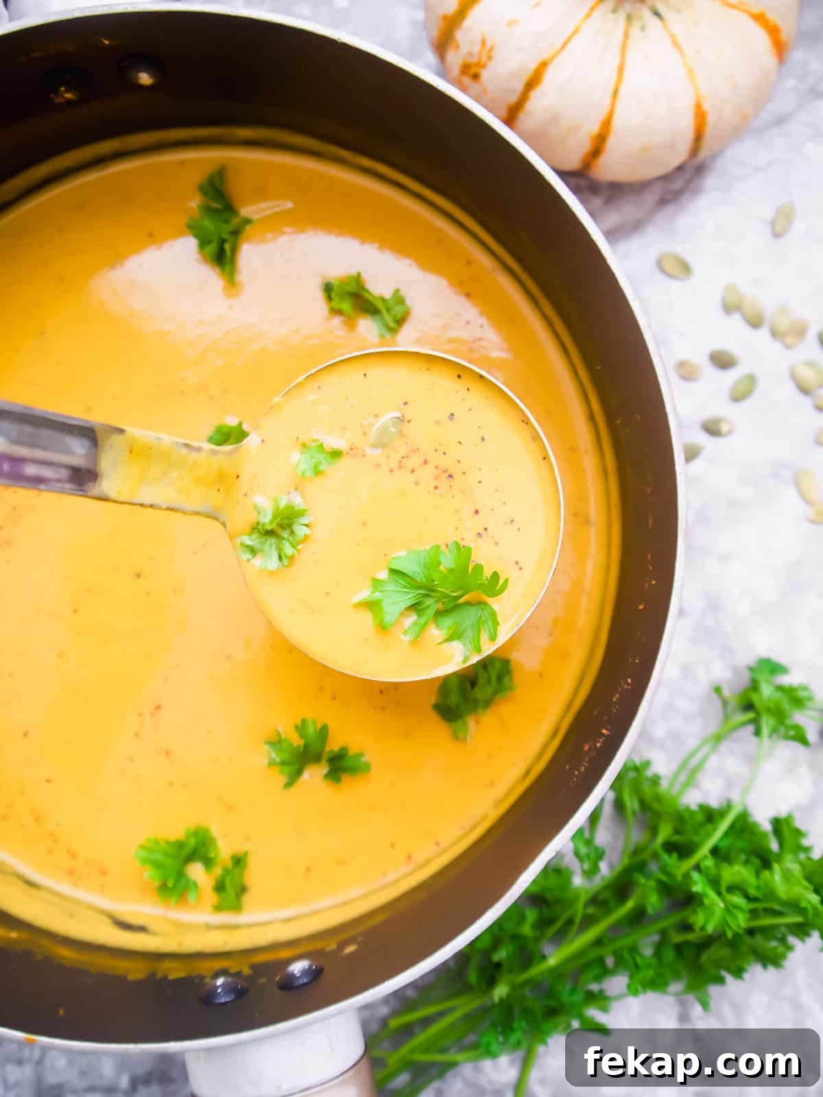 Roasted Pumpkin and Sweet Potato Soup Recipe 11 Sweet potato pumpkin soup being served.