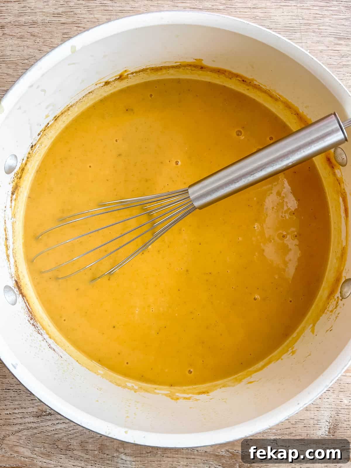 Roasted Pumpkin and Sweet Potato Soup Recipe 10 Sweet potato pumpkin soup being whisked.