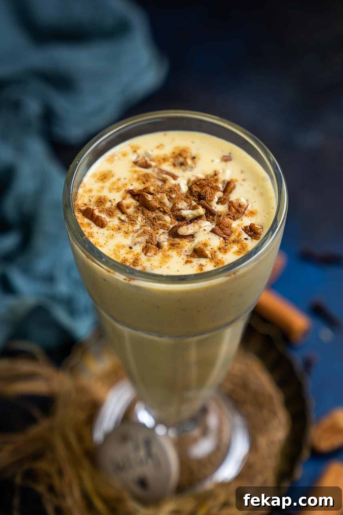 Pumpkin pie spice smoothie served in a glass.