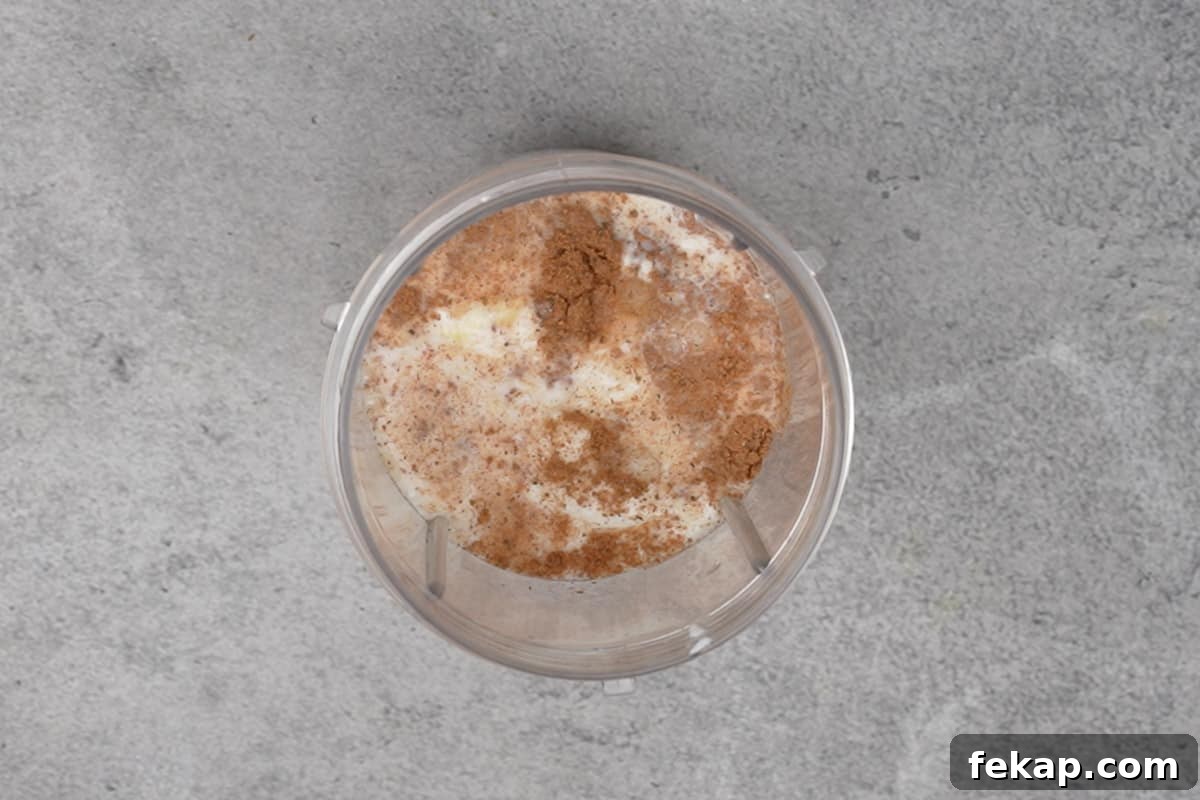 All the ingredients added to a blender.