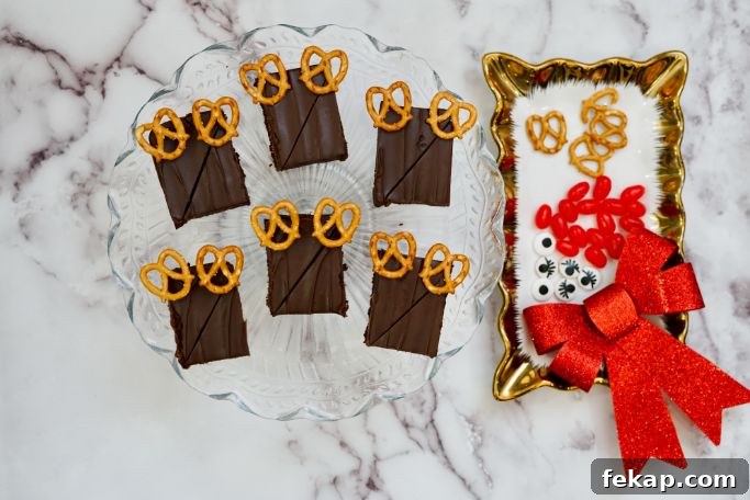 Festive Reindeer Brownies Recipe for Christmas Parties 6 brownies are cut into rectangles with pretzel antlers in place