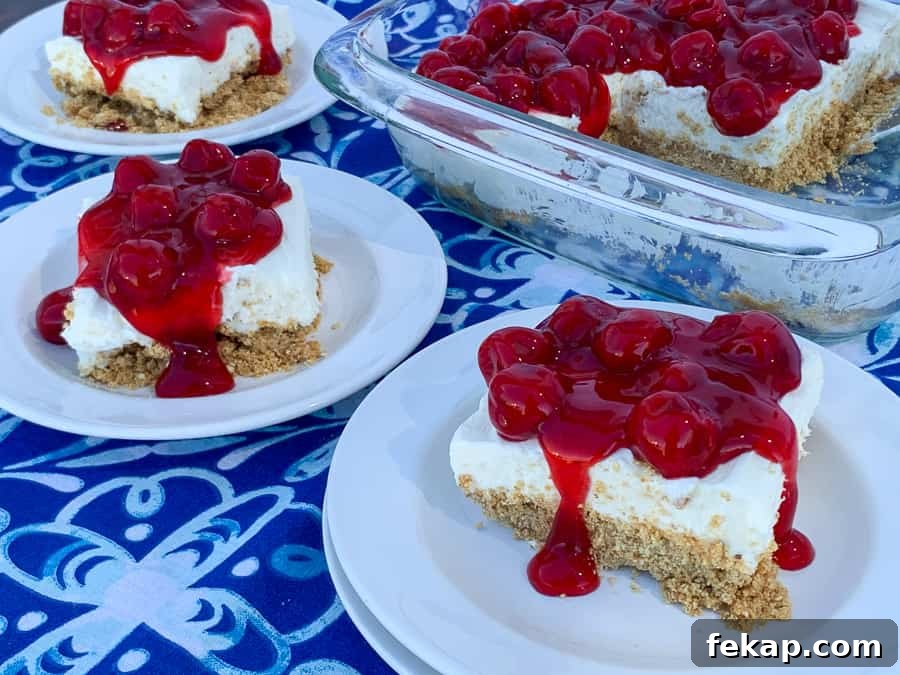 No-Bake Cherry Delight Recipe 3 Several pieces of cherry delight dessert next to pan full