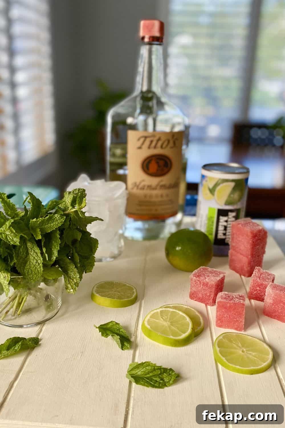 vodka, limeade concentrate, mint, lime and ice cubes