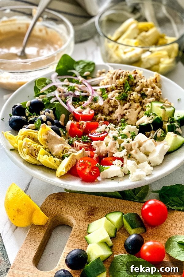 Mediterranean Quinoa Bowls with Maple Tahini Dressing Recipe 2 quinoa bowls with artichokes, olives, feta and tahini dressing