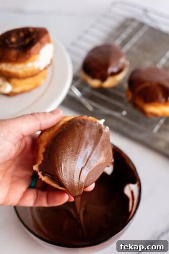 Mini Boston Cream Pies, Southern-Style 10 Dipping mini Boston cream pie into chocolate icing