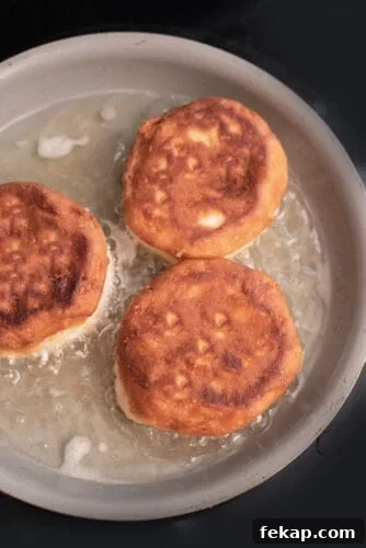 Mini Boston Cream Pies, Southern-Style 5 Golden brown biscuits cooking in oil