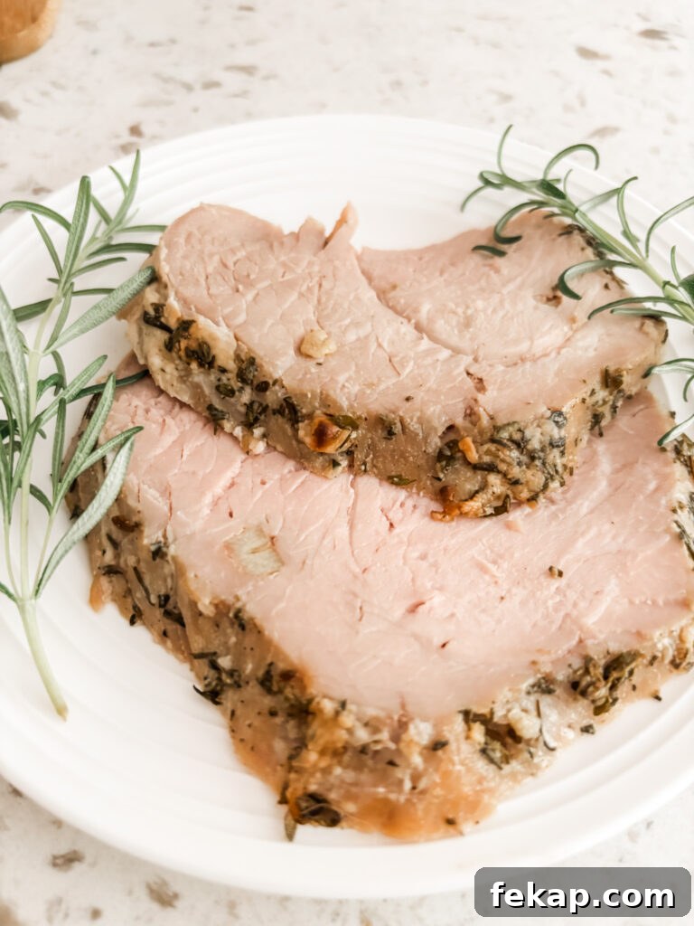Herb-Rubbed Pork Sirloin Roast Recipe 3 Two slices of the Pork Sirloin Roast with springs or rosemary