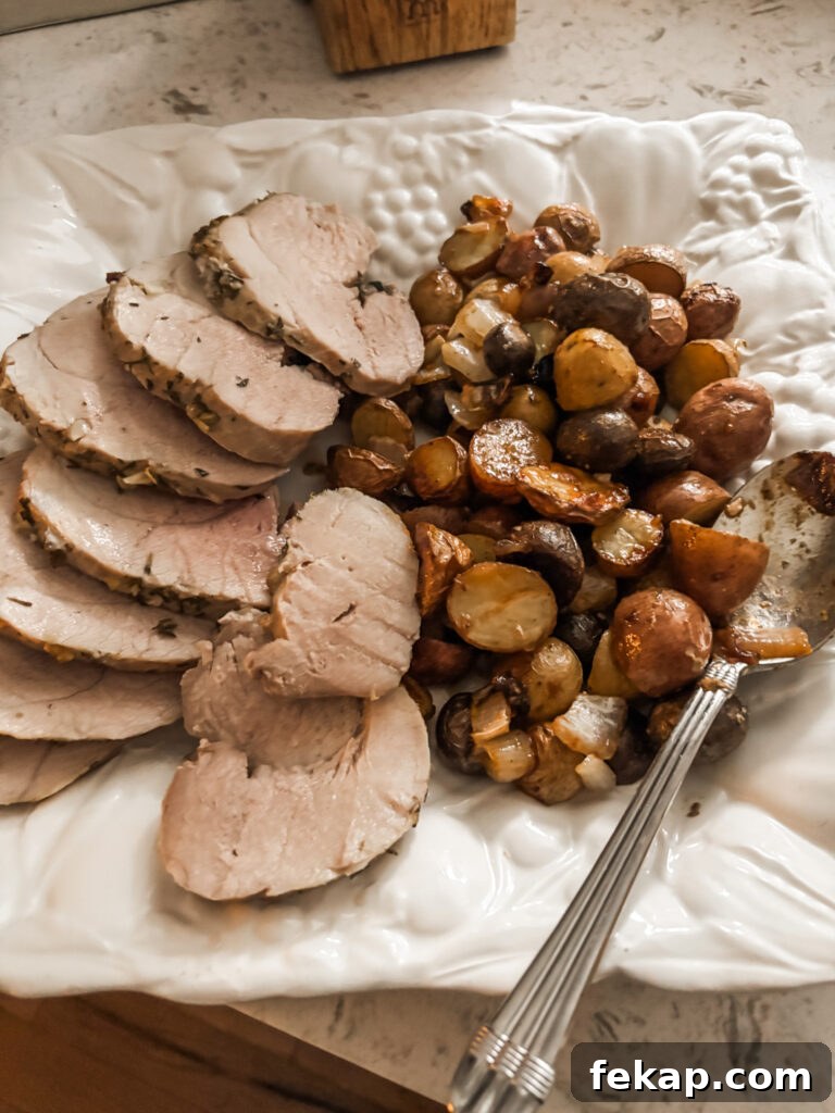 Herb-Rubbed Pork Sirloin Roast Recipe 7 The roast pork and veggies out of the overn