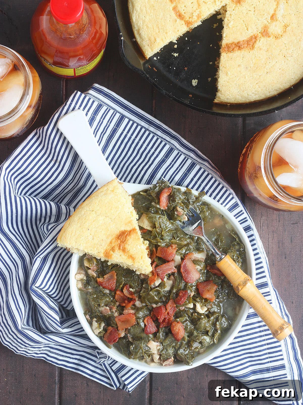 How to Make Southern Turnip Greens 2 Turnip greens in a white bowl with a wedge of cornbread on the side.